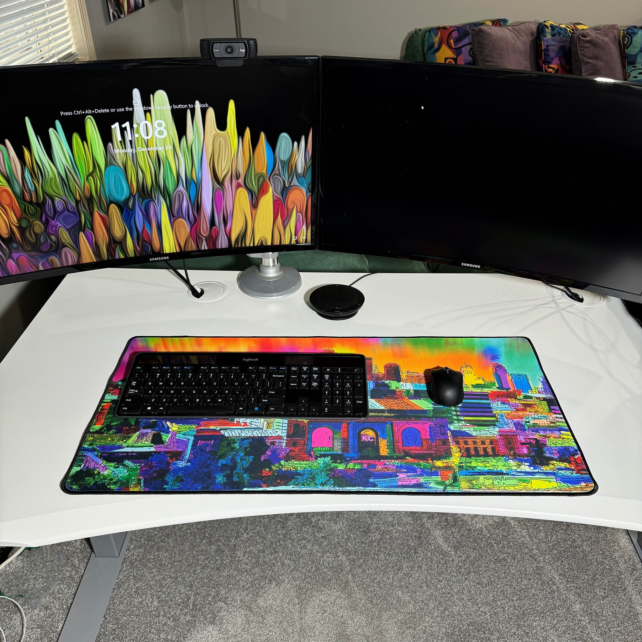colorful neoprene desk mat on a white desk with a keyboard and mouse